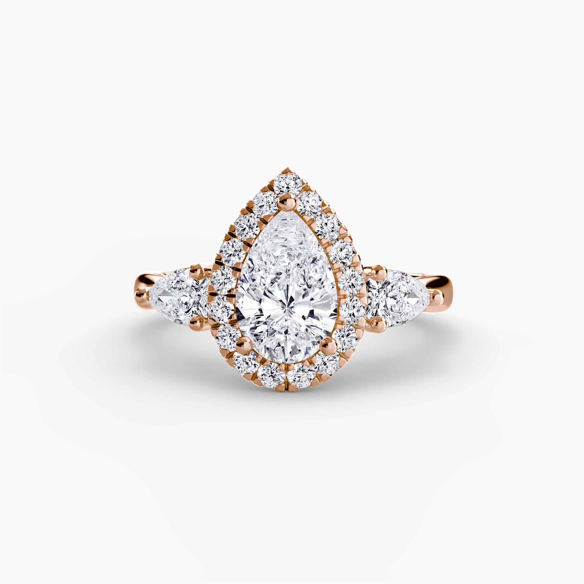 Three-stone ring with halo