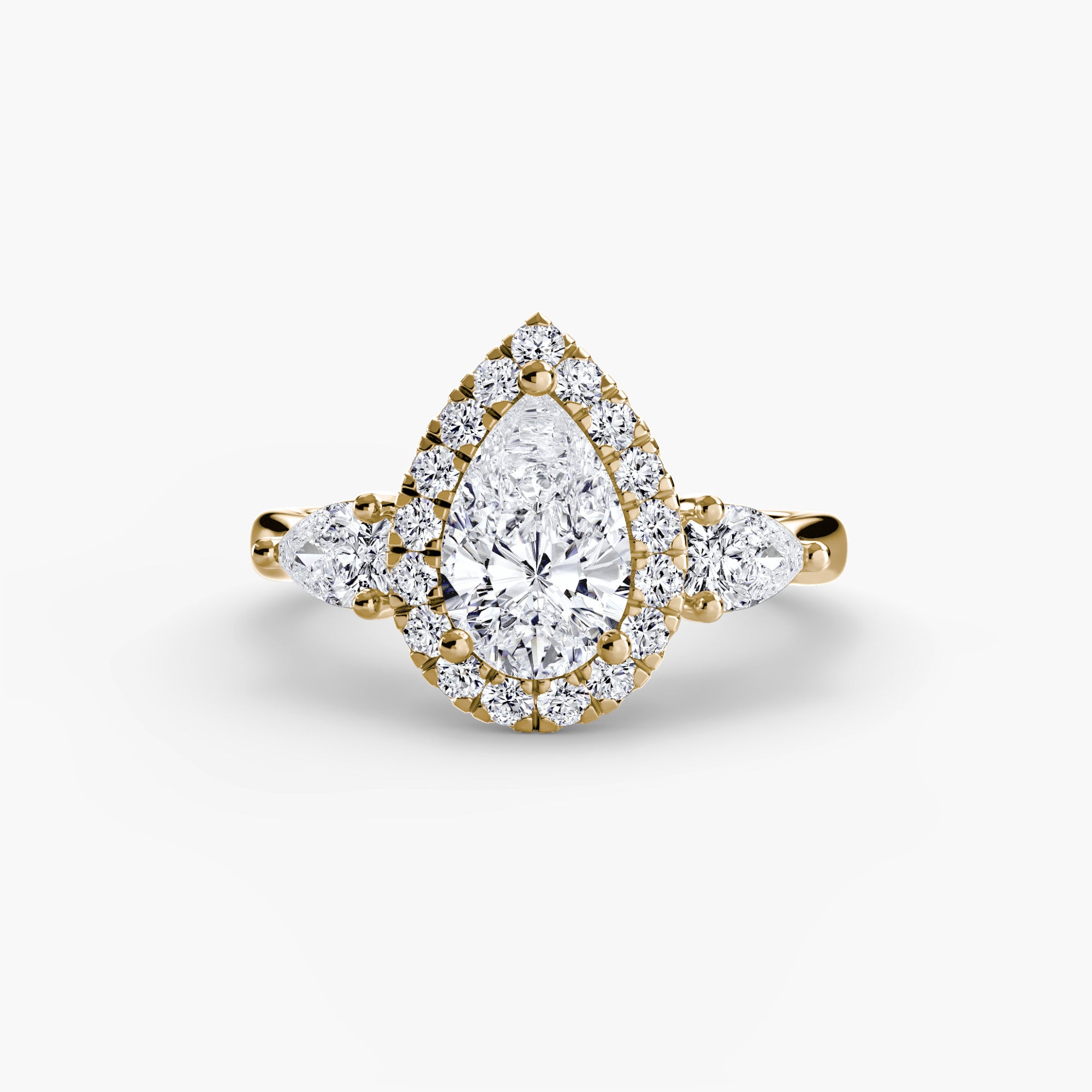 Three-stone ring with halo